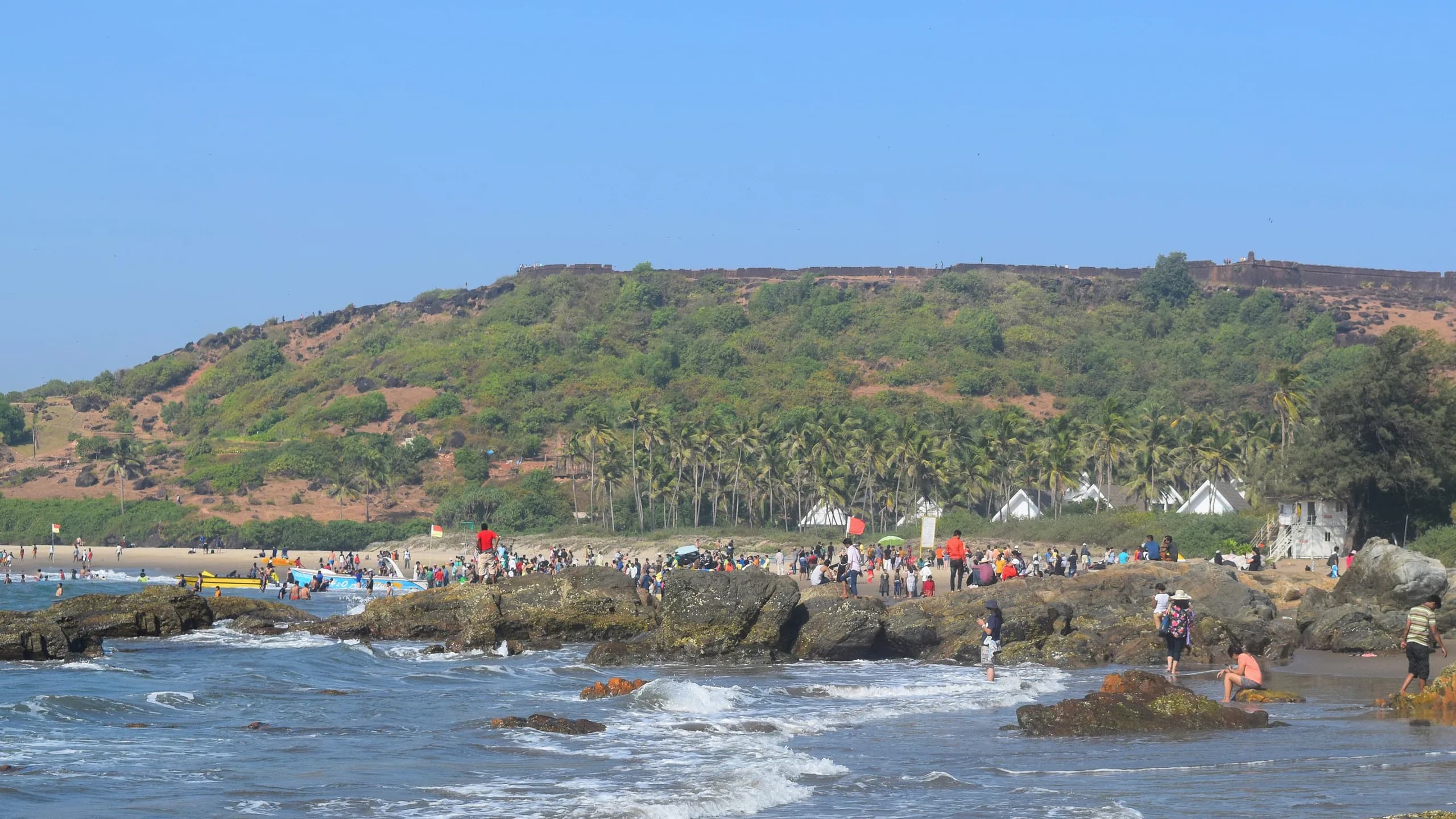 Vagator beach with Chapora Fort on the headland above, North Goa